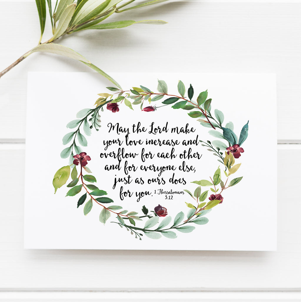 1 Thessalonians 3:12 scripture print with botanical wreath, Christian wall art featuring love overflow verse, perfect Christmas gift for family.