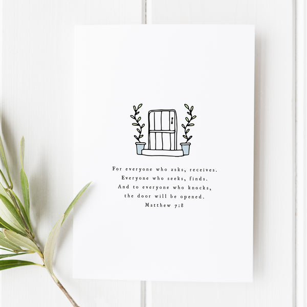 A bible verse art print from Snow and Company featuring Matthew 7:8. The verse is written in a classic traditional font under a hand-illustrated door. The perfect gift.