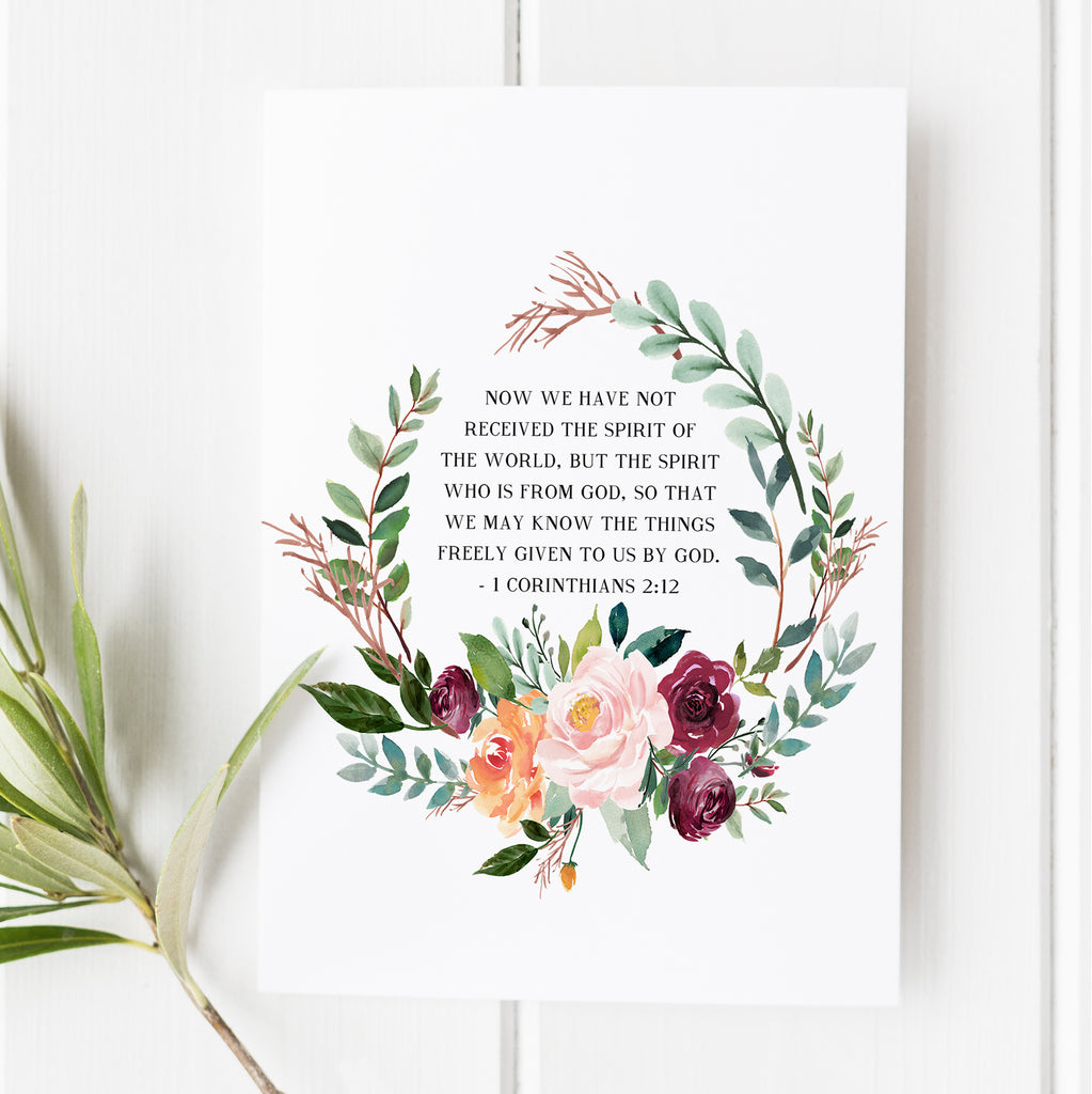 1 Corinthians 2:12 scripture art print with floral wreath design, Christian wall decor, inspirational faith-based gift, perfect for Christmas or special occasions.